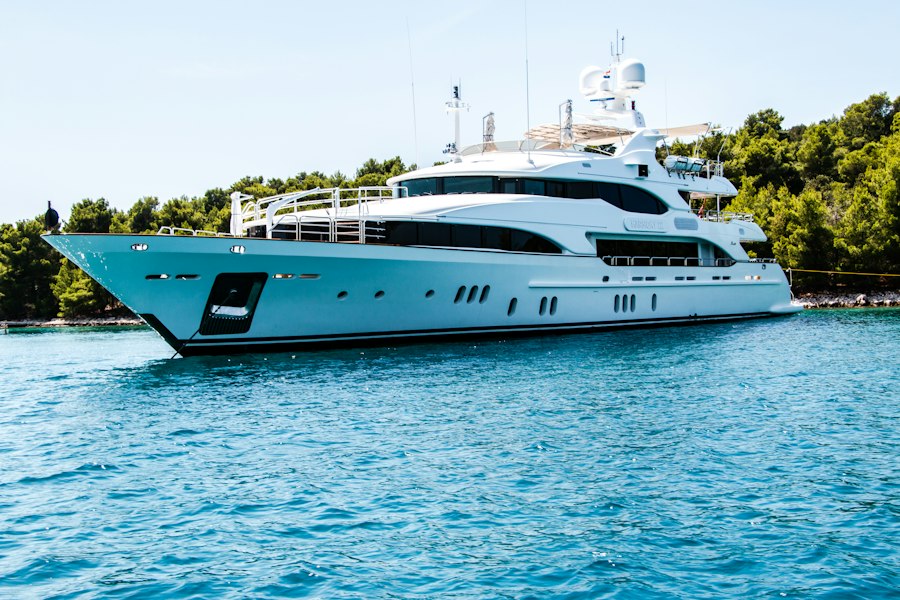 Luxury yacht sailing on turquoise sea